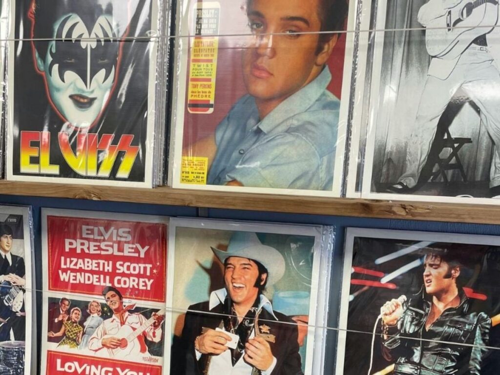 Elvis hair in various styles as posters filling a wall